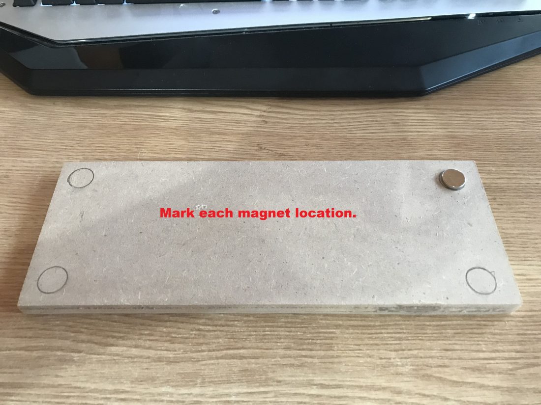 Mark the position of the magnets